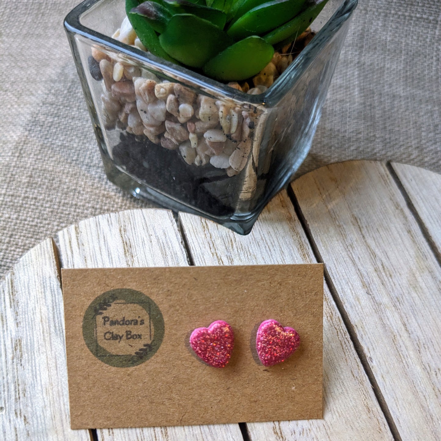 Pink glitter heart studs