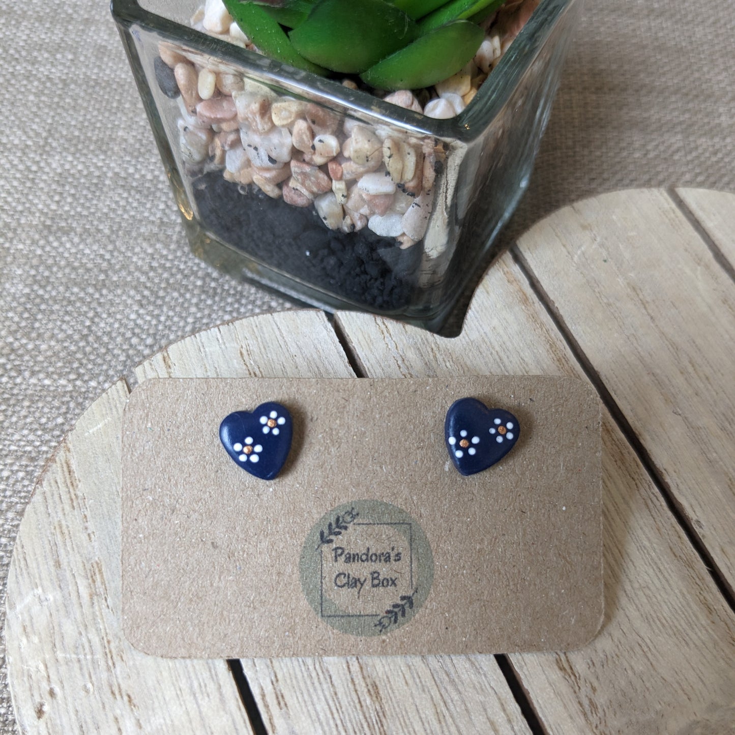 Navy flower heart studs